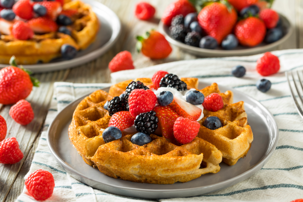 Perfect round waffle topped with berries and cream